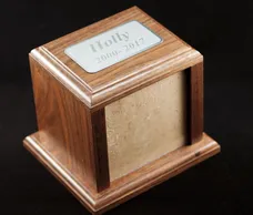 Wooden photo urn with a framed top insert and engraved nameplate, designed for a pet’s memorial.